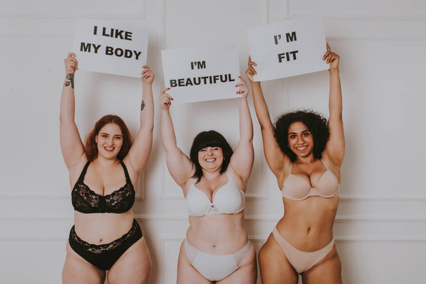 Group of 3 oversize women posing in studio - Beautiful girls accepting body imperfection, beauty shots in studio - Concepts about body acceptance, body positivity and diversity - Фото, изображение
