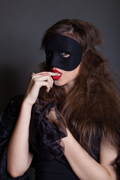 Portrait of a woman in a mask - Φωτογραφία, εικόνα