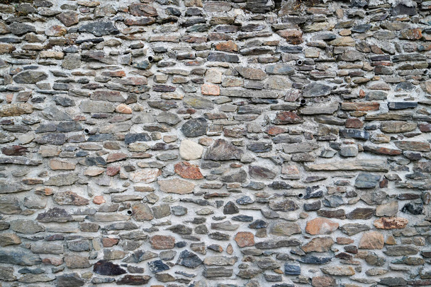 Old weathered stone grey wall of medieval brick horizontal grunge background - Photo, Image