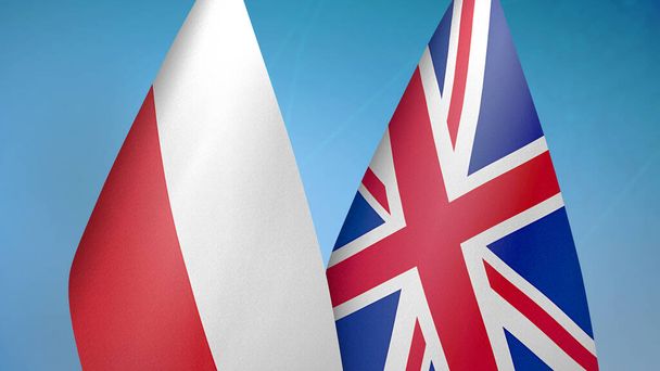 Πολωνία και Ηνωμένο Βασίλειο δύο σημαίες μαζί μπλε φόντο - Φωτογραφία, εικόνα