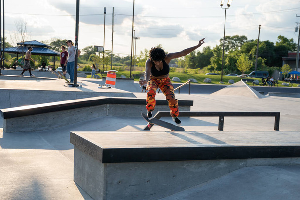 Detroit, Michigan, USA - 7.24.2020: Skaters and bikers practice tricks at an outdoor skate park during the Corona Virus in Detroit. - Фото, зображення