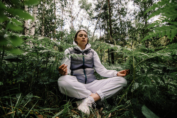 girl meditating in siberian forest - Foto, Imagen