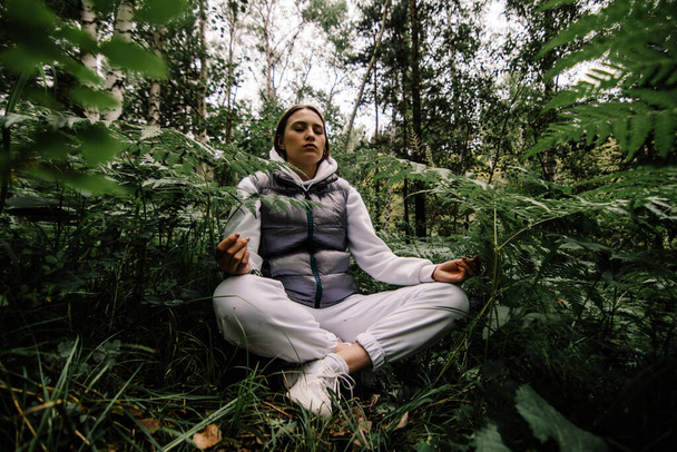 girl meditating in siberian forest - Фото, изображение