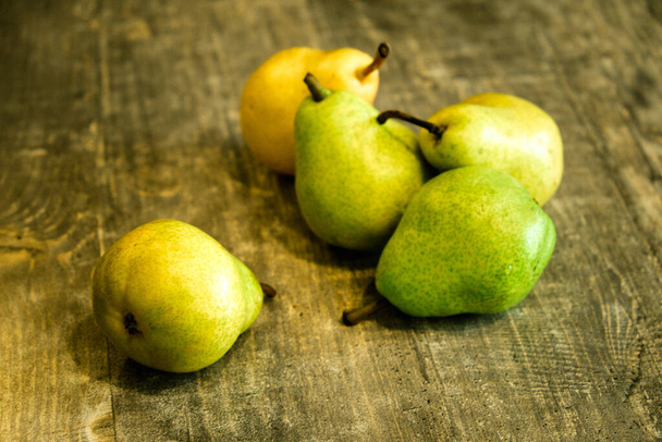 Pears on dark wooden background - Foto, Imagem