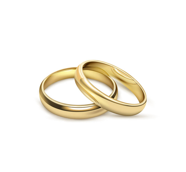 Золотые обручальные кольца изолированы на белом фоне - Фото, изображение