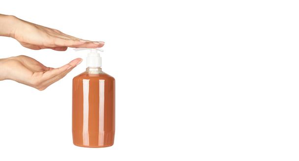 Liquid antibacterial soap in bottle with hand. Isolated on white background. - Φωτογραφία, εικόνα