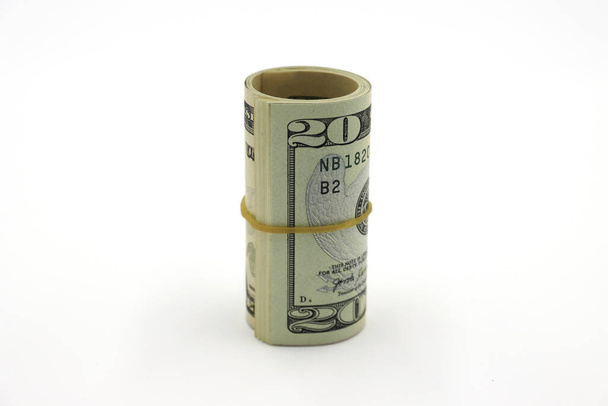 Peníze. Roll dolarů izolovaných na bílém pozadí. - Fotografie, Obrázek