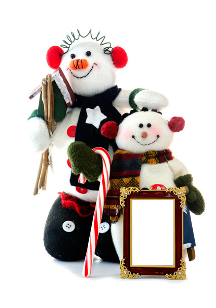 dva snowean s prázdnou fotorámeček, ptačí budky, cukrové třtiny na bílém pozadí - Fotografie, Obrázek
