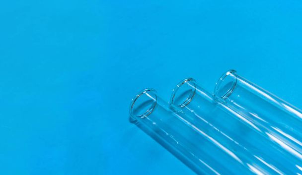 Chemical test tubes on a blue background with a blank space for your text. - Photo, Image