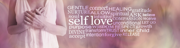 Divine Feminine Self love word cloud - torso of female holding hands over heart against a flesh coloured background with a SELF LOVE word cloud to the right side - Photo, Image