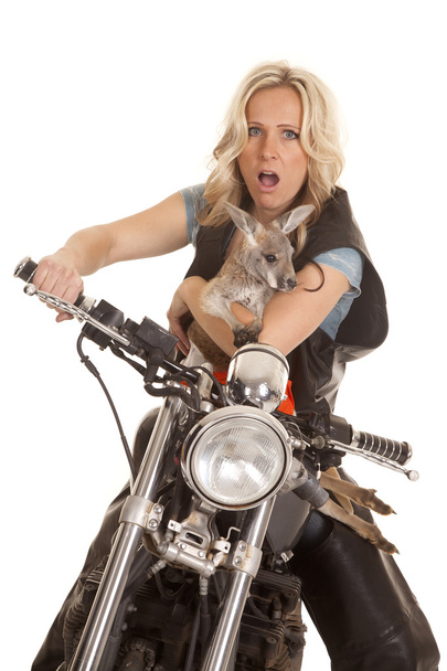 Woman on motorcycle with kangaroo shocked - Fotoğraf, Görsel