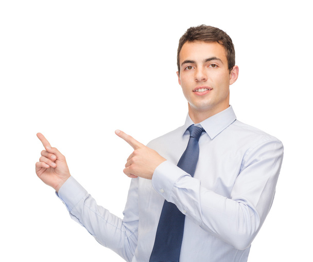 Man pointing finger to something on virtual screen - Photo, image