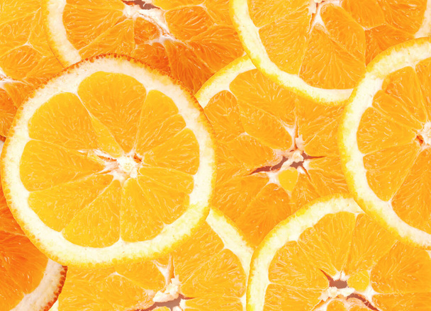 Obrázek řezu oranžového ovoce na pozadí - Fotografie, Obrázek