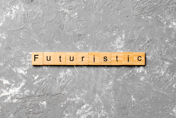 Futuristic word written on wood block. Futuristic text on cement table for your desing, concept. - Photo, Image
