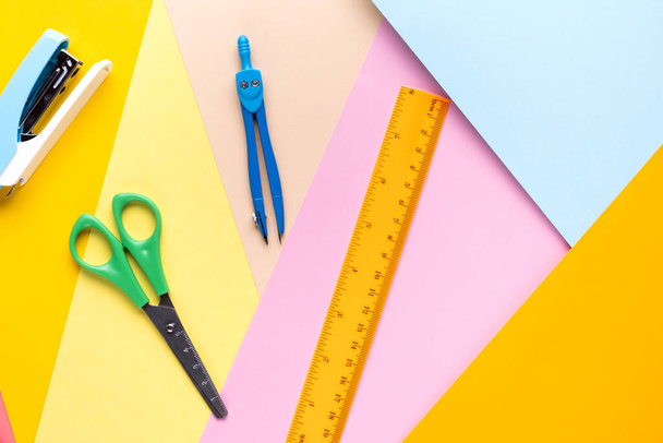 Different school tools on colorful paper copy space background. - Foto, Bild