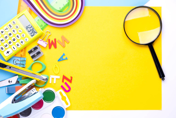 Many different school supplies on yellow copy space background. Back to school concept. - Photo, Image