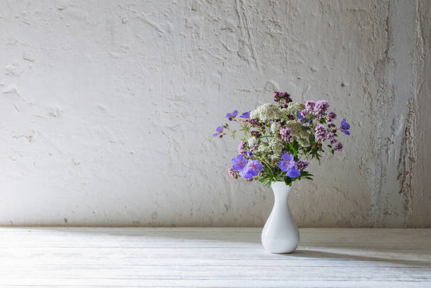 wild flowers in white vase on white background - Фото, зображення