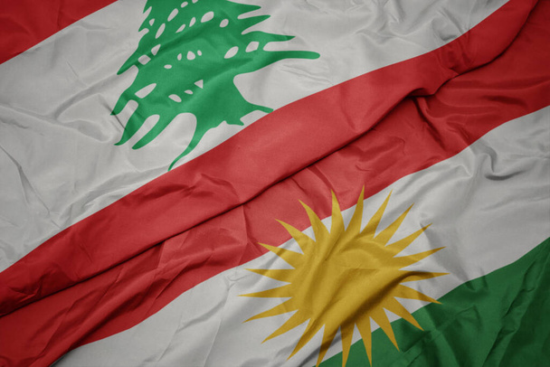 sventolando bandiera colorata del kurdistan e bandiera nazionale del libanone. macro - Foto, immagini