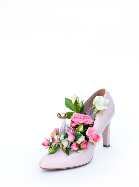 Comfortable womens shoes with middle heels with flowers on white background. - Fotoğraf, Görsel