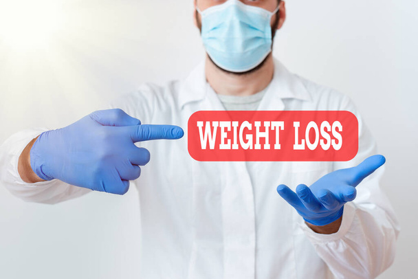 Text sign showing Weight Loss. Conceptual photo a reduction of the total body mass due to a mean loss of fluid Laboratory Technician Featuring Empty Sticker Paper Accessories Smartphone. - Photo, Image