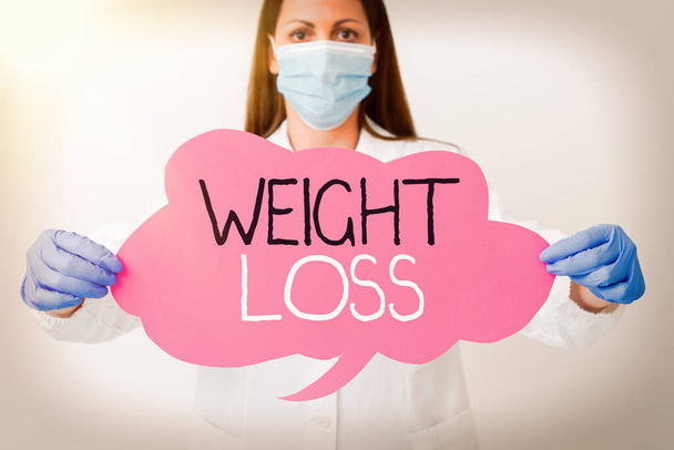 Word writing text Weight Loss. Business concept for a reduction of the total body mass due to a mean loss of fluid Laboratory technician featuring empty sticker paper accessories smartphone. - Photo, Image