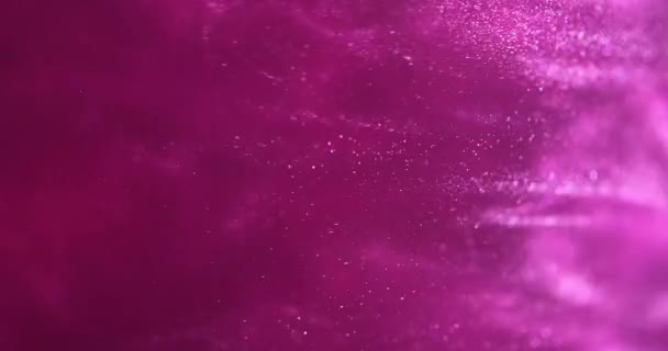 抽象的な雲の形成を作成するピンクのキラキラ塗料。美術の背景。フクシア色のインクが渦巻いている - 映像、動画