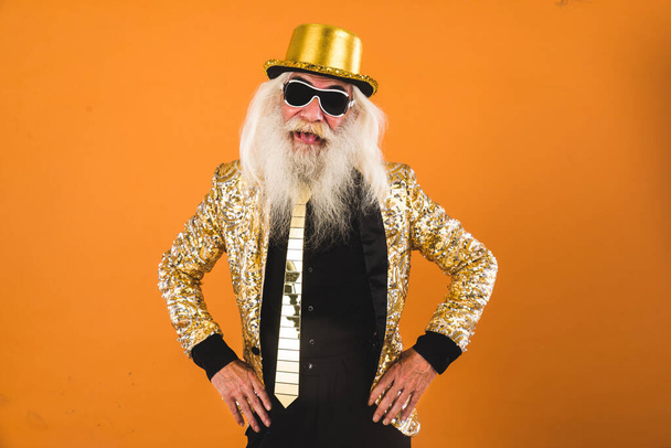 Senior man with eccentric look  - 60 years old man having fun, portrait on colored background, concepts about youthful senior people and lifestyle - Zdjęcie, obraz