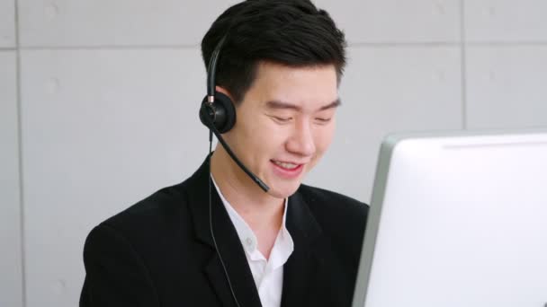 Business people wearing headset working in office - Filmati, video