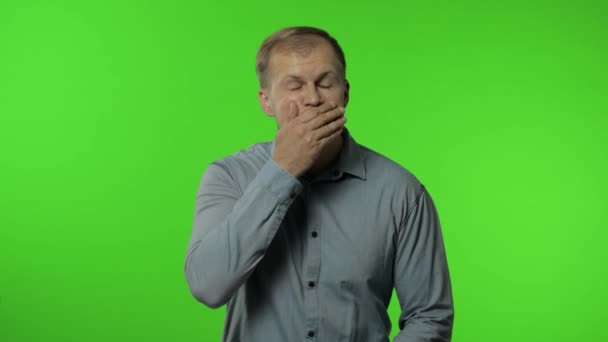 Man isolated on chroma key background. Closing mouth with hand, gestures no, refusing to tell secret - Footage, Video
