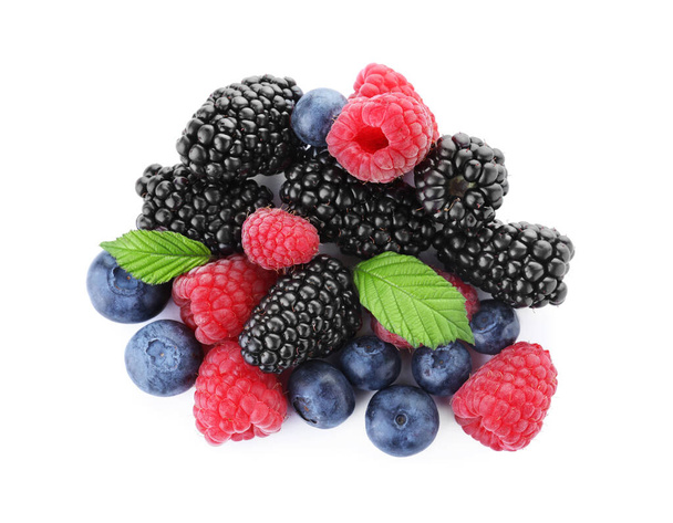 Pile of different ripe tasty berries with green leaves isolated on white, top view - Φωτογραφία, εικόνα