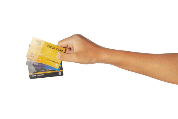 Tarjeta de crédito de mano aislada sobre fondo blanco. caminos de recorte
. - Foto, imagen