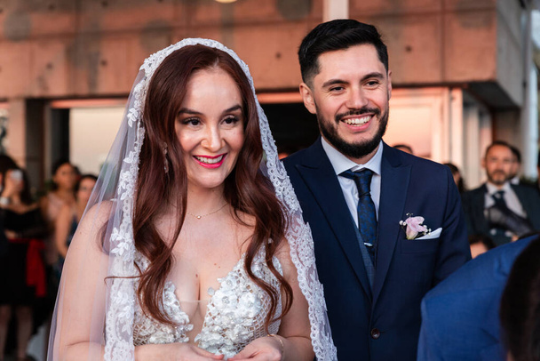 portrait of happy couple marrying redheaded woman to latin man, lifestyle concept - Foto, Imagem