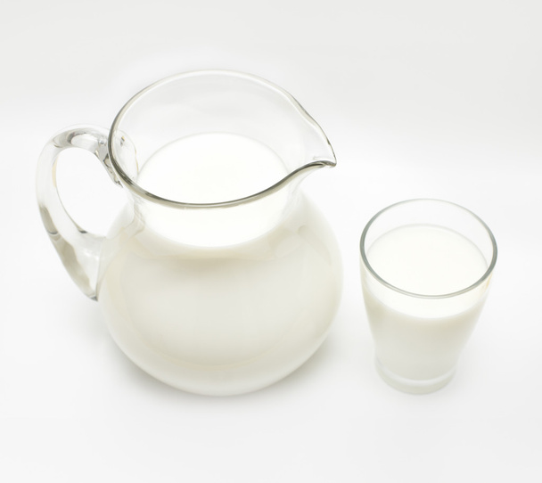 Jar and glass with milk - Фото, зображення