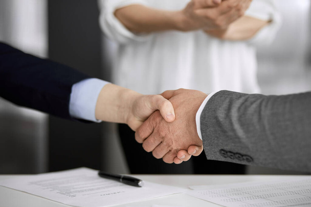 Business people shaking hands finishing contract signing, close-up. Business communication concept. Handshake and marketing - Foto, Bild