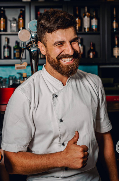 Portrait of smiling chef standing in bar - Photo, Image