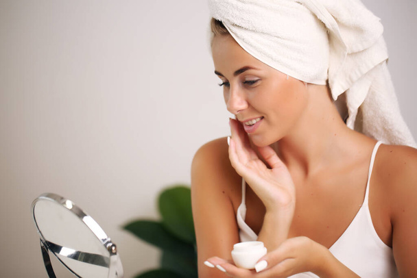 beauty and spa. Facial treatment. Cosmetology girl with clean fresh skin touching her own face - Foto, Imagem