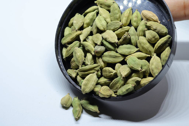 Green Dried cardamom seeds isolated on white background - Photo, Image