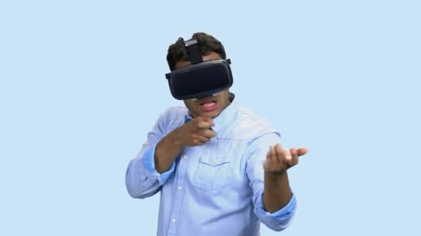 Young man wearing virtual reality glasses. - Video