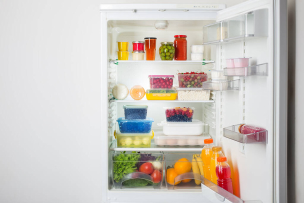 refrigerator with different healthy food - Foto, afbeelding