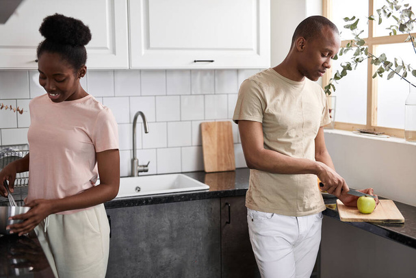 african couple having a good time together in the kitchen - 写真・画像