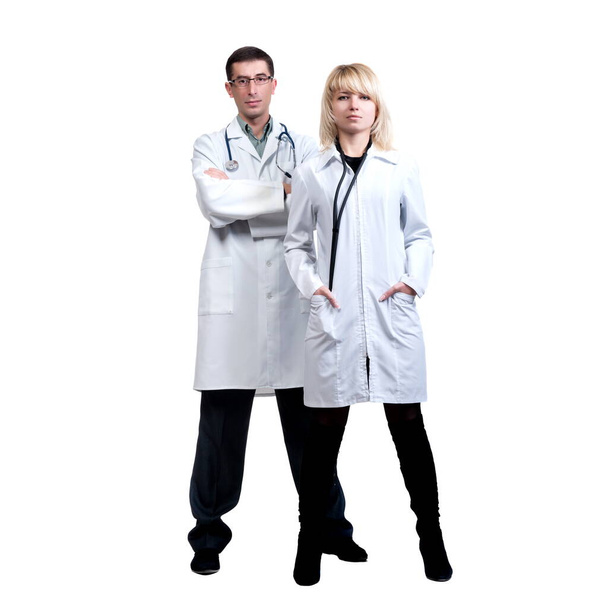 Man and woman in white coats of doctors with stethoscopes on a white background in isolation - Fotoğraf, Görsel
