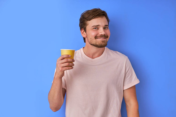 cheerful man with cup of tea - Fotó, kép