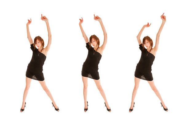 Three full length poses of an attractive young female dancer in black dress and high heels with her arms up in the air, isolated on white studio background - Photo, Image