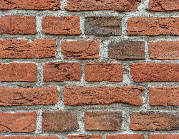 Background old masonry of red brick. Plaster, concrete, cement. Cracks, peeling, voids. Close-up - Valokuva, kuva