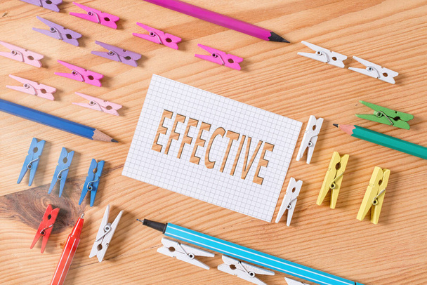 Conceptual hand writing showing Effective. Business photo text equal to the rate of simple interest that yields the same amount Colored crumpled papers wooden floor background clothespin. - Photo, Image
