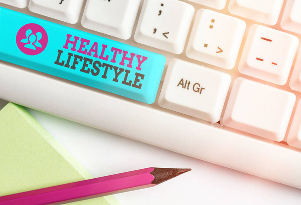 Word writing text Healthy Lifestyle. Business concept for way of living that lowers the risk of being seriously ill Different colored keyboard key with accessories arranged on empty copy space. - Photo, Image