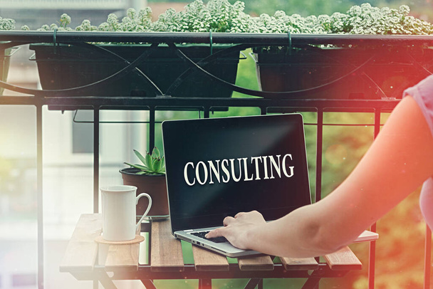 Word writing text Consulting. Business concept for business of giving expert advice typically in business matters Personal workplace overview with laptop device used for individual interest. - Photo, Image