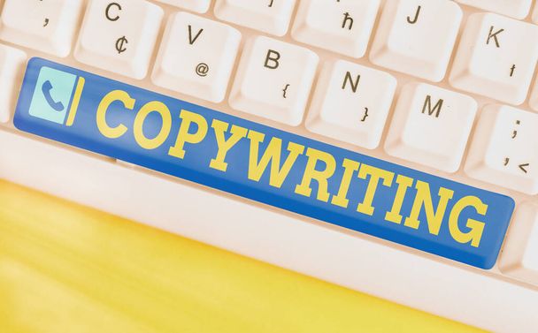 Conceptual hand writing showing Copywriting. Business photo text writing the text of advertisements or publicity material Colored keyboard key with accessories arranged on empty copy space. - Photo, Image