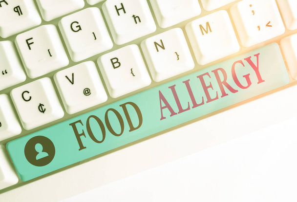 Writing note showing Food Allergy. Business photo showcasing abnormal immune system response to allergen after eaten Colored keyboard key with accessories arranged on empty copy space. - Fotografie, Obrázek