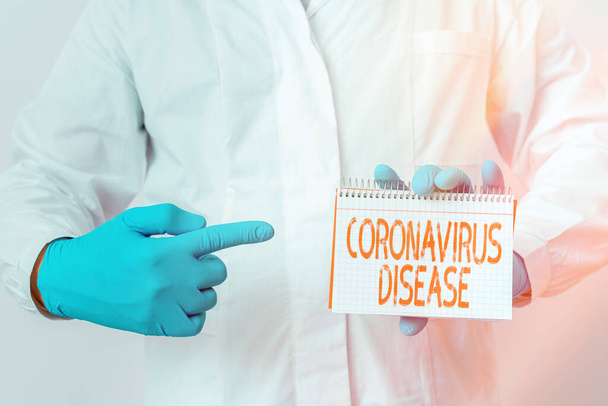 Writing note showing Coronavirus Disease. Business photo showcasing defined as illness caused by a novel virus SARSCoV2 Laboratory Technician Featuring Sticker Paper Smartphone. - Photo, Image